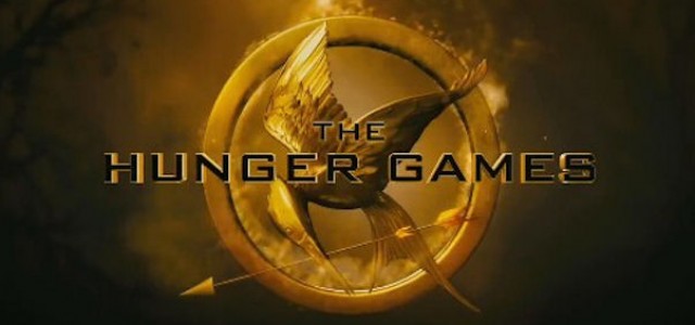 The Hunger Games: New Image of Katniss Being Escorted to the Games